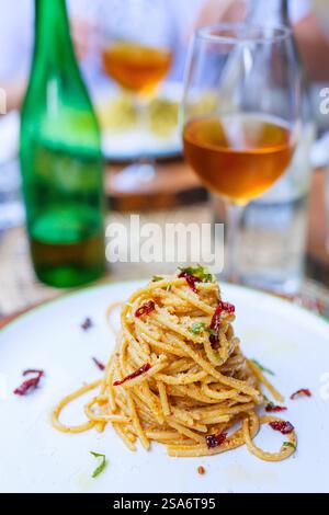 Delicious spaghetti served for lunch or dinner in farm-to-table restaurant in Italy Stock Photo