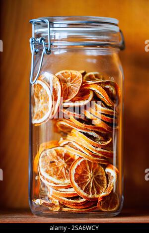 Dried orange slices in transparent jar Stock Photo