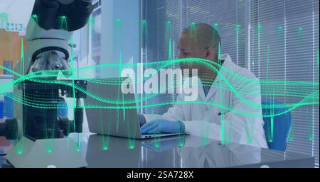 Image of scientific data processing over biracial male scientist in laboratory Stock Photo
