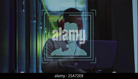 Image of biometric photos and male african american technician using laptop in server room Stock Photo