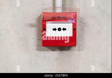 Fire alarm switch on the factory wall. Stock Photo
