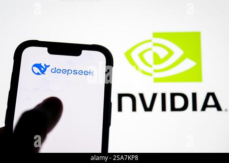 In this photo illustration, the Deepseek logo seen displayed on a smartphone with the Nvidia logo in the background. A Chinese-made artificial intelligence (AI) model called DeepSeek has become the most popular app in the Apple Store. According to the news, AI is much cheaper and uses less advanced chips. This news caused Nvidia to lose almost $600 billion (£482 billion) of its market value on Monday, the biggest single-day loss in US history. (Photo by Mateusz Slodkowski/SOPA Images/Sipa USA) *** Strictly for editorial news purposes only *** Stock Photo