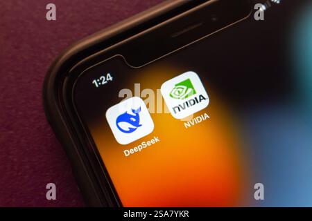 DeepSeek and NVIDIA logos are displayed on an iPhone, representing AI technology and the semiconductor industry. Stock Photo