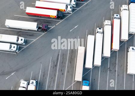 PRAGUE , CZECH REPUBLIC - SEPTEMBER 10 2024: Truck drives along specialized parking lot to leave food warehouse territory. Vehicle for delivering products ensures fast and efficient distribution Stock Photo