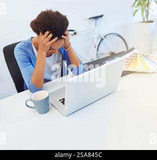 Creative, woman and laptop with stress in office for home renovation crisis, layout plan mistake and project deadline. Interior designer, frustrated Stock Photo