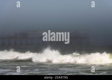 Breakers on Palm Beach and Swakopmund Jetty in the fog, Swakopmund, Erongo, Namibia Stock Photo
