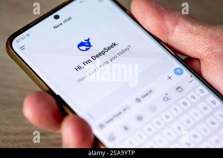 London. UK- 01.29.2025. A person holding a mobile phone using the Chinese open source artificial intelligence application DeepSeek. Stock Photo