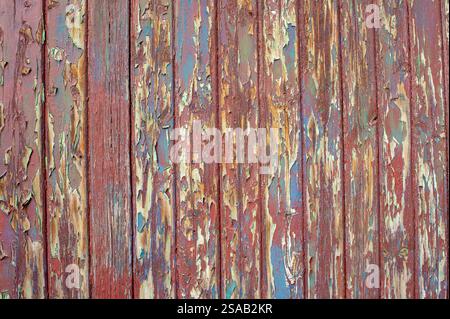 old wooden wall with peeling paint texture material Stock Photo