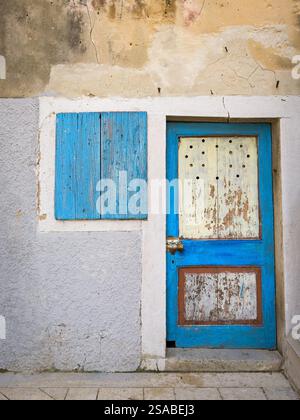 Old weathered blue door made of wood in Croatia (Island Cres) Stock Photo