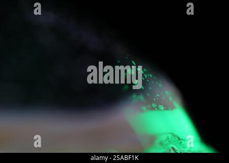 Green liquid edge on the dark background, colourful abstract, green shapes, minimalism, line of light, black and green Stock Photo