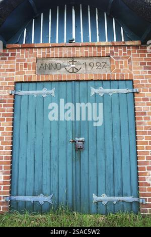Old, green wooden gate Stock Photo