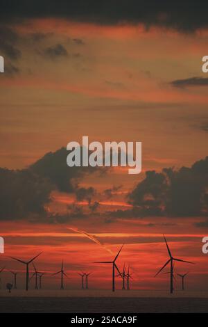 Sky over Baltic Sea wind farm at sunset Stock Photo