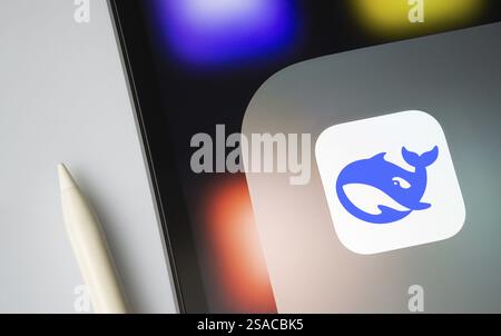 A close up of an iPad screen displaying the Deepseek Ai app icon Stock Photo