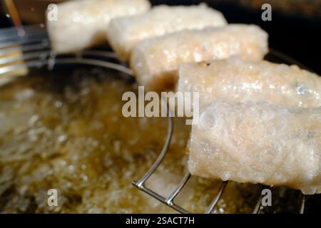Making traditional Vietnamese pork spring rolls.  Street food. Stock Photo