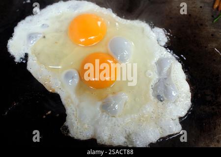Two fried eggs in a pan.  Breakfast.  Paris.  France. Stock Photo