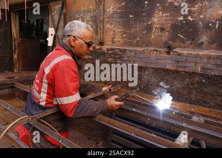 Welder at work in a workshop in Marrakesh, Morocco Stock Photo