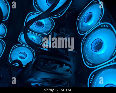 Multiple cooling fans emit blue light, showcasing efficient airflow and design Stock Photo