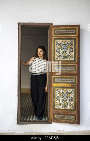 Young woman standing in Bahia Palace, Marrakesh, Morocco Stock Photo