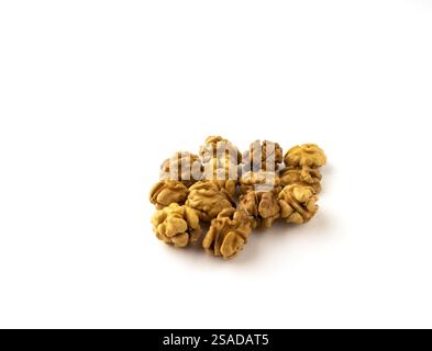 Whole walnut kernels on a white background. Stock Photo