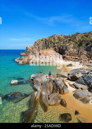 Young couple on stunning white sand tropical beach in Vietnam enjoying vacation Stock Photo