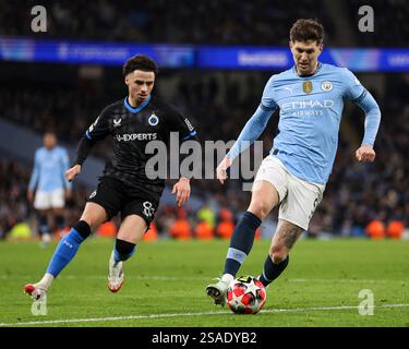 John Stones of Manchester City under pressure from Ezri Konsa of Aston ...