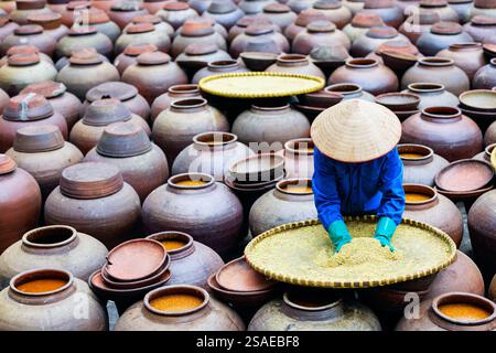 Ceramics pots where soya beans are fermented to produce soy sauce in Hung Yen province in Vietnam Stock Photo