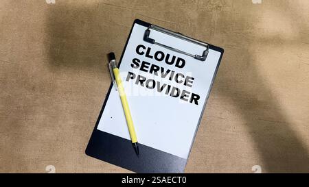Concept of Cloud Service Provider write on paperwork isolated on Wooden Table. Stock Photo