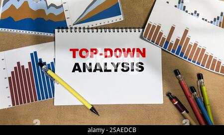 Concept of Top-Down Analysis write on book isolated on Wooden Table. Stock Photo