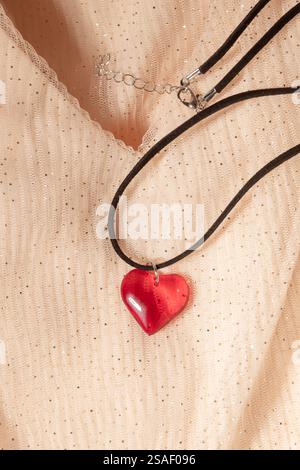 Concept with waves pink mesh fabric and necklace. Retro fashion aesthetic. Can use as wedding background. Luxurious background design Stock Photo