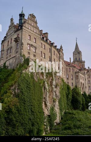 Majestic Sigmaringen Castle Perched on Rugged Cliff Above Tranquil Danube: Historic Hohenzollern Residence Showcases Medieval Architecture and Royal Stock Photo