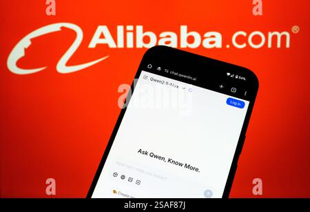 Qwen AI interface seen on the screen of smartphone and blurred Alibaba logo on the background. Stafford, UK, January 29, 2025 Stock Photo
