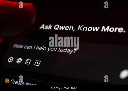 Qwen 2.5 max AI dark software interface seen on the screen of smartphone and finger pointing at it. Macro photo. Stafford, UK, January 29, 2025 Stock Photo