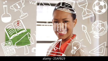 In school, in classroom, biracial female teacher watches students ...