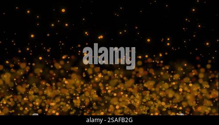 Golden particles floating and glowing over dark background, creating magical image Stock Photo