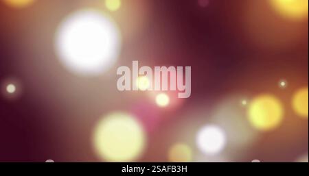 Colorful bokeh image with pink, orange, and white light circles on dark background Stock Photo