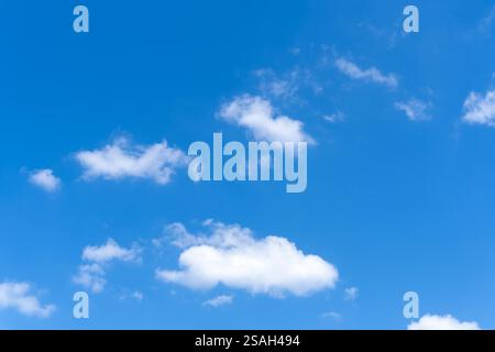 Low angle view and full frame of beautiful blue sky with strange shape of fluffy white clouds in the morning or evening on sunny day Stock Photo