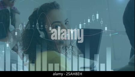 Image of financial data processing over diverse colleagues using phone headsets and computers Stock Photo