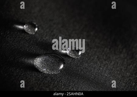 Many water drops on waterproof impregnated fabric. Stock Photo