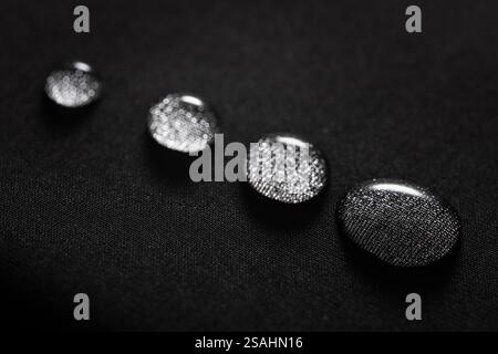 Many water drops on waterproof impregnated fabric. Stock Photo