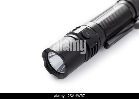 black rechargeable electric LED flashlight isolated on white background. Stock Photo