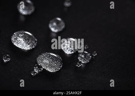 Many water drops on waterproof impregnated fabric. Stock Photo