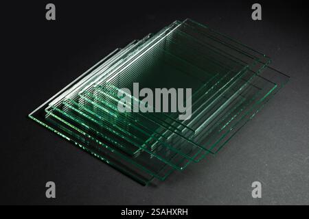 Glass factories produce glass used in buildings and homes. There are many different thicknesses and sizes. Stock Photo