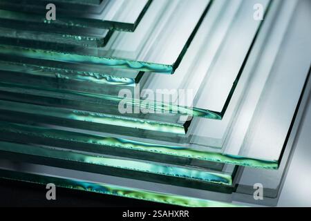 Glass factories produce glass used in buildings and homes. There are many different thicknesses and sizes. Stock Photo