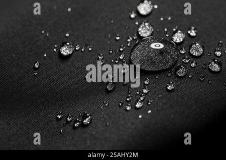 Many water drops on waterproof impregnated fabric. Stock Photo