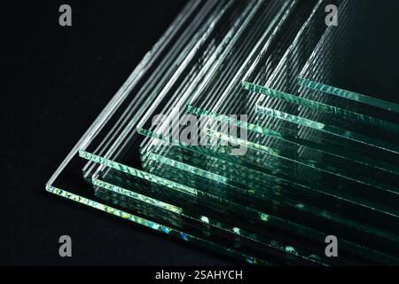 Glass factories produce glass used in buildings and homes. There are many different thicknesses and sizes. Stock Photo