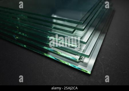 Glass factories produce glass used in buildings and homes. There are many different thicknesses and sizes. Stock Photo