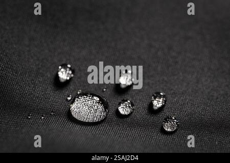 Many water drops on waterproof impregnated fabric. Stock Photo