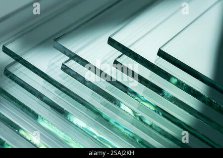 Glass factories produce glass used in buildings and homes. There are many different thicknesses and sizes. Stock Photo