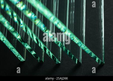 Glass factories produce glass used in buildings and homes. There are many different thicknesses and sizes. Stock Photo