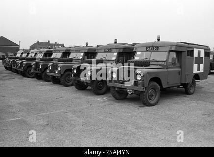 Line of army land rover ambulances at army base on Salisbury Plain 1990. Stock Photo